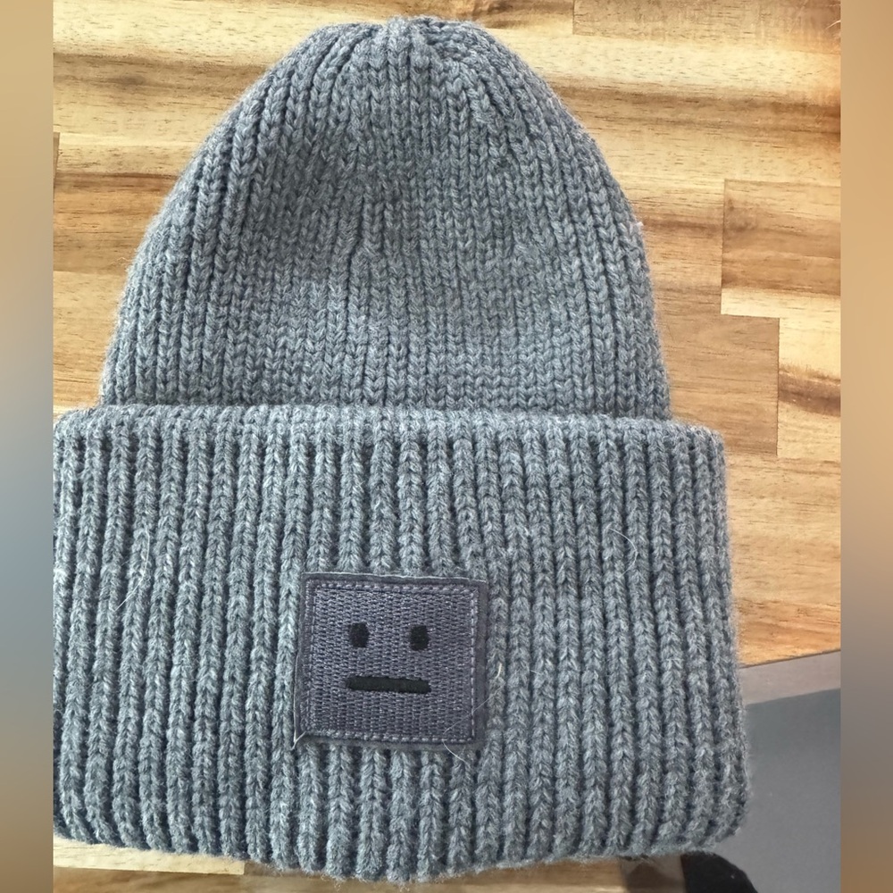 Grey knit beanie with patch . Great condition